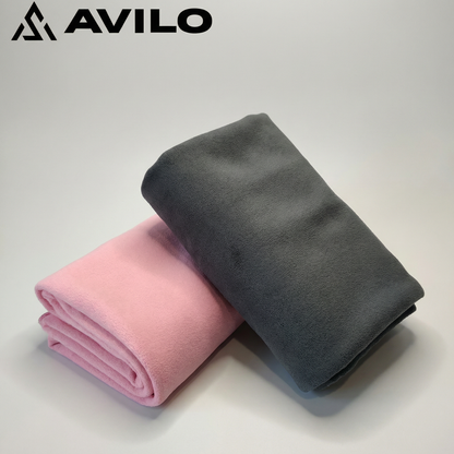 Two folded towels, one pink and one gray, on a light background with 'AVILO' branding.