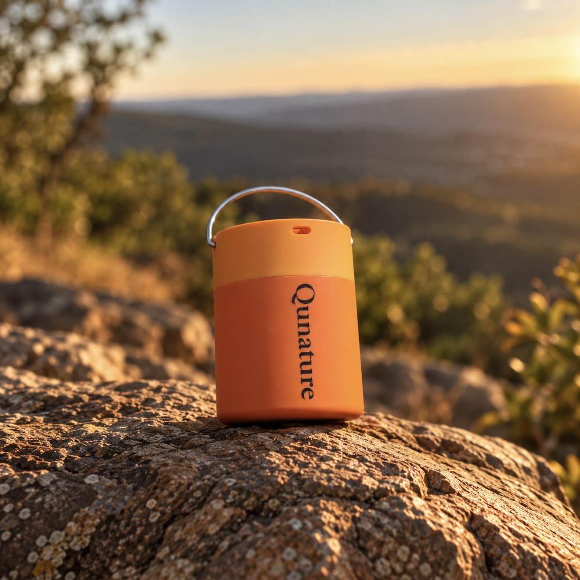 The orange Qunature Atomic Pump on a rock at sunset :: Orange