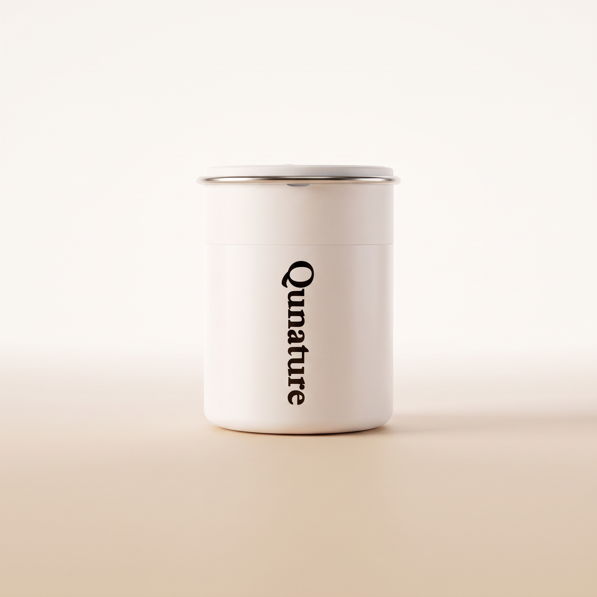 The white Qunature Atomic Pump seen from the front on a plain cream background :: White