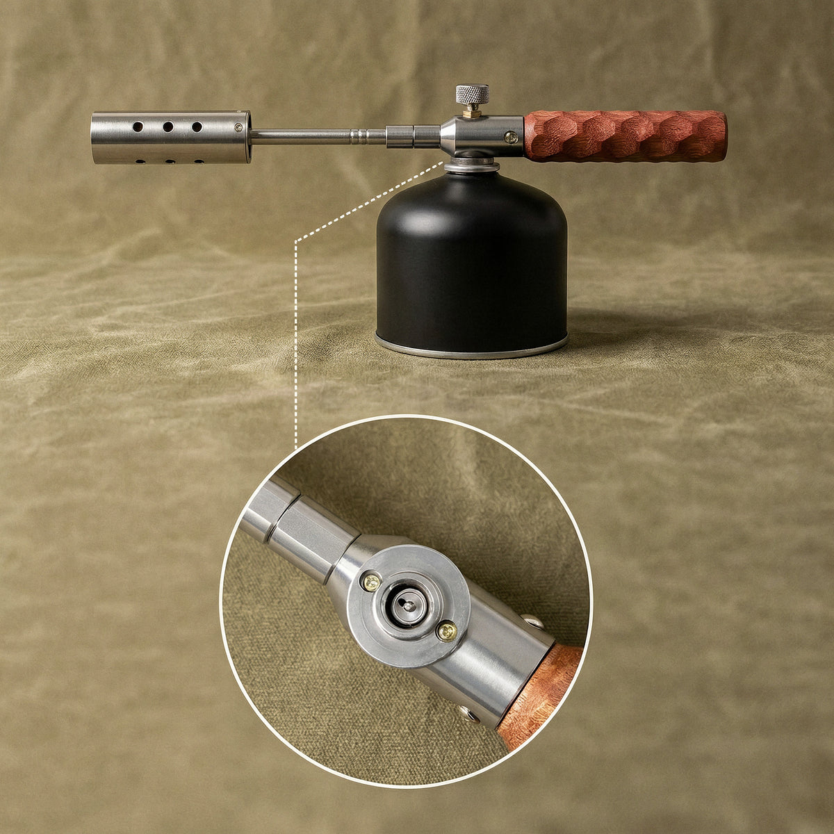 The torch on a threaded gas canister, with a close-up of the gas connection on the underside of the valve